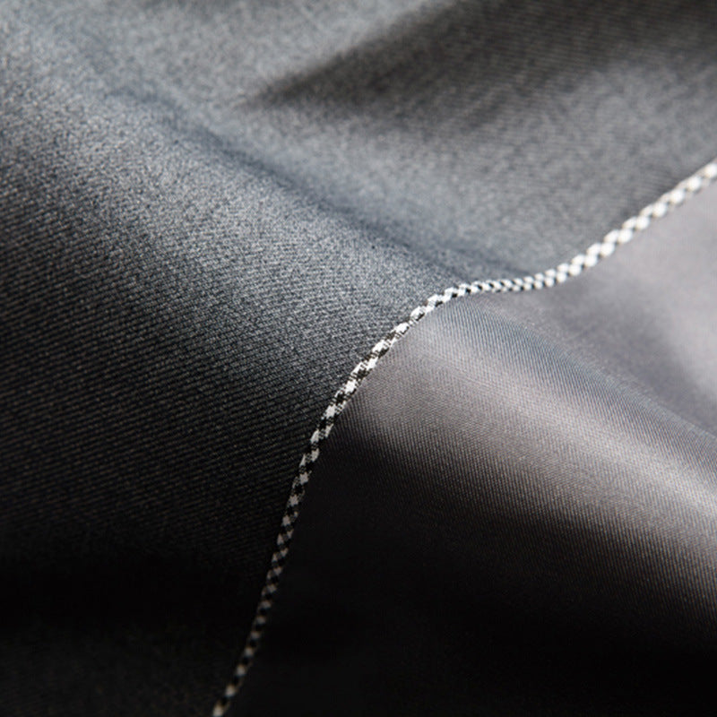 Tailored men's three-piece suit: slim fit jacket, vest, trousers. Perfect for a sharp, modern formal event look.