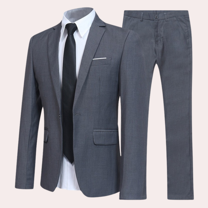 Sophisticated all-season men's slim fit suit. Versatile two-piece includes tailored blazer and matching dress trousers.