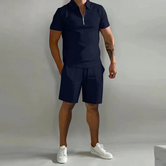 Men's sophisticated summer outfit: modern zipper polo and casual drawstring shorts for a sharp look.