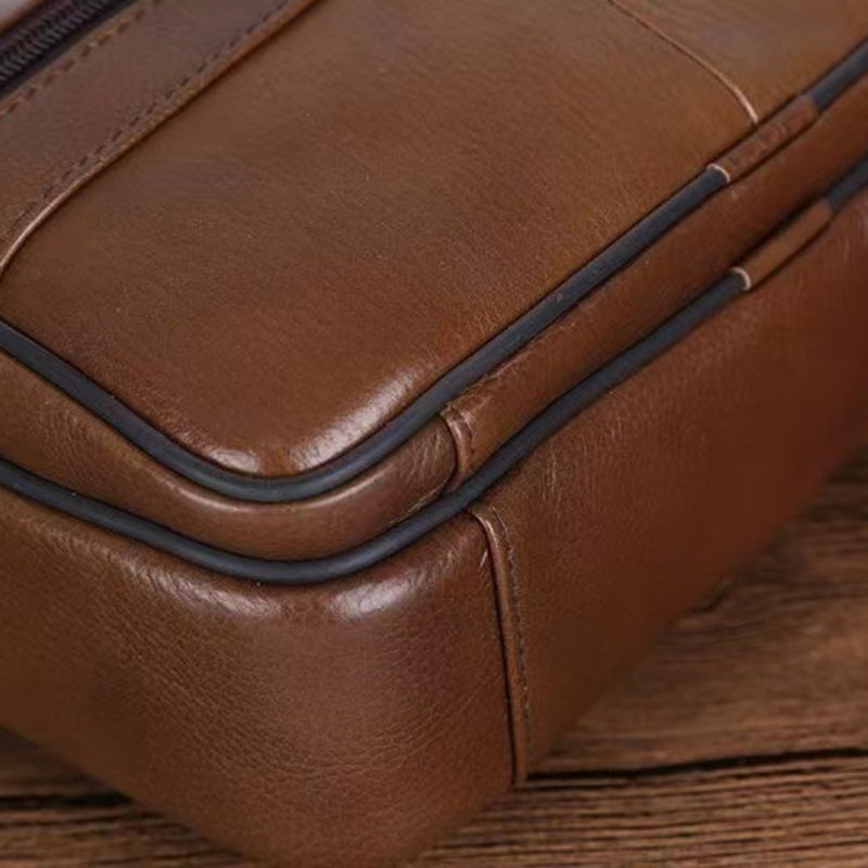 Men's spacious travel shoulder bag with a secure, adjustable strap for comfortable carrying.