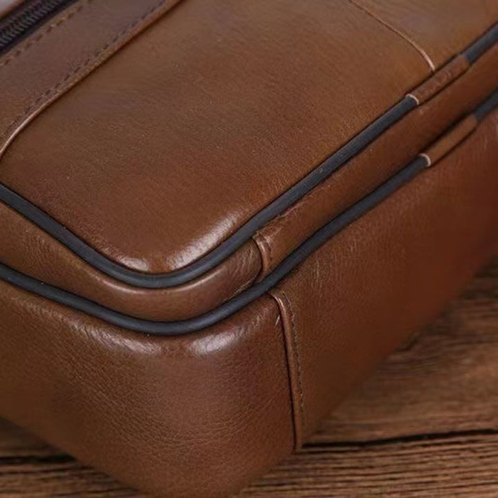 Men's spacious travel shoulder bag with a secure, adjustable strap for comfortable carrying.