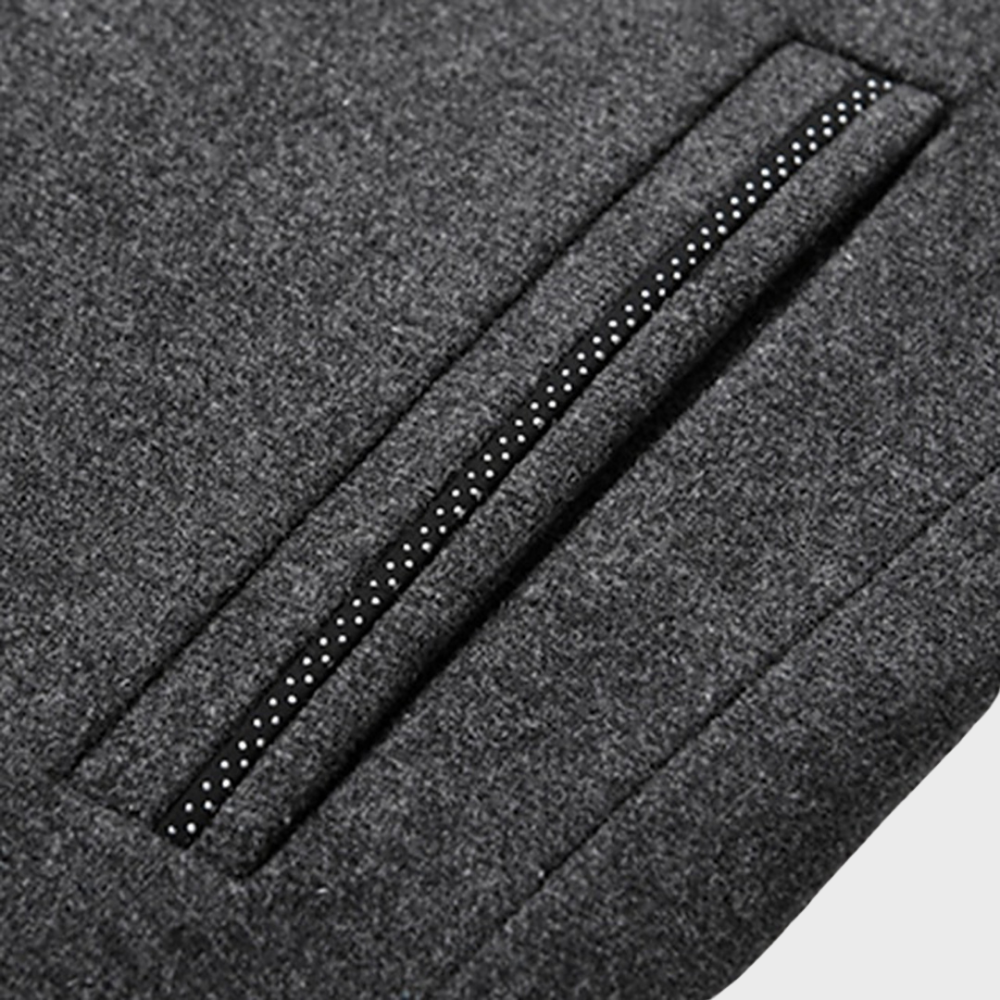Close-up of the stand collar and side pockets on a men's business trench coat, showing detail.