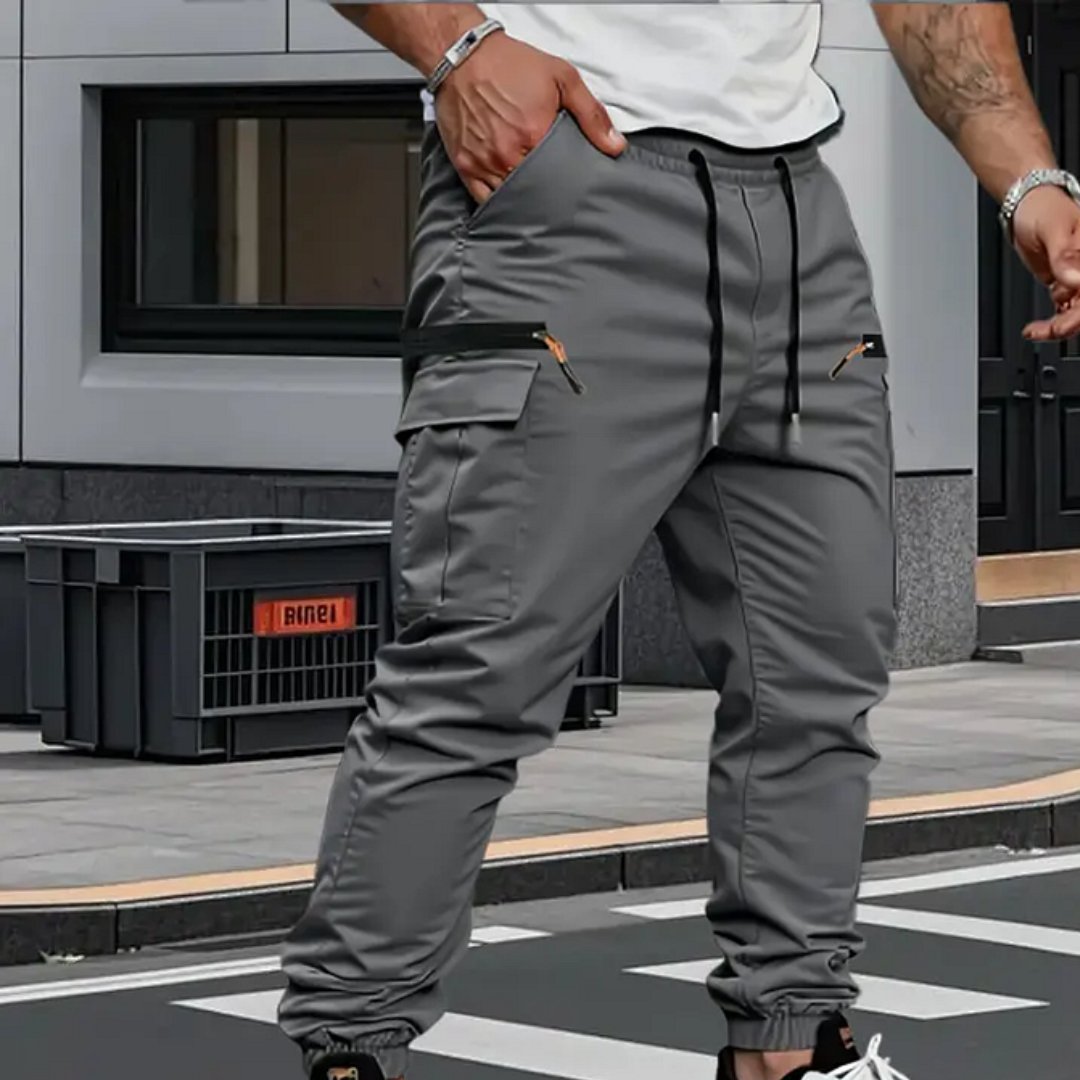 Versatile men's stretch cargo jogger pants for comfort, style, & activewear. Tapered fit and drawstring waist.