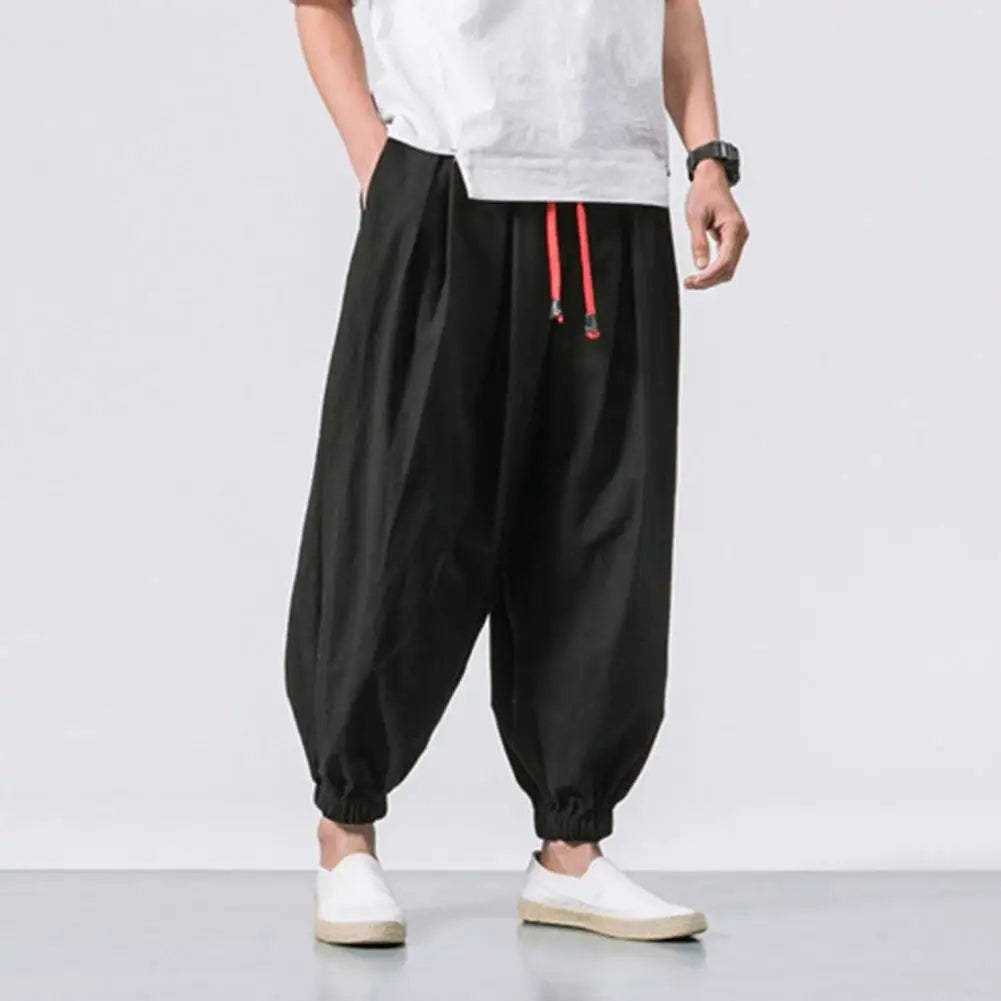 Comfortable men's baggy jogger pants with elastic waist and drawstring. Ideal for lounging and casual wear.