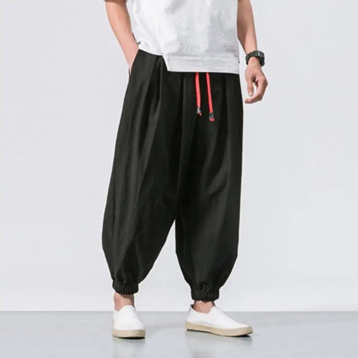 Comfortable men's baggy jogger pants with elastic waist and drawstring. Ideal for lounging and casual wear.