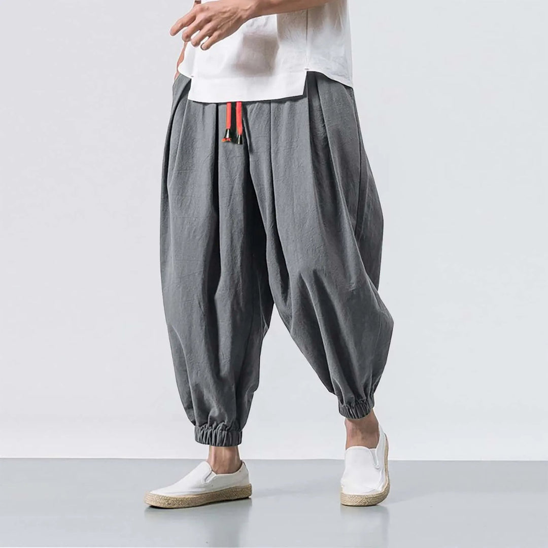 Men's comfortable Harem Jogger Pants worn outdoors, ideal for casual, everyday wear or light activity.