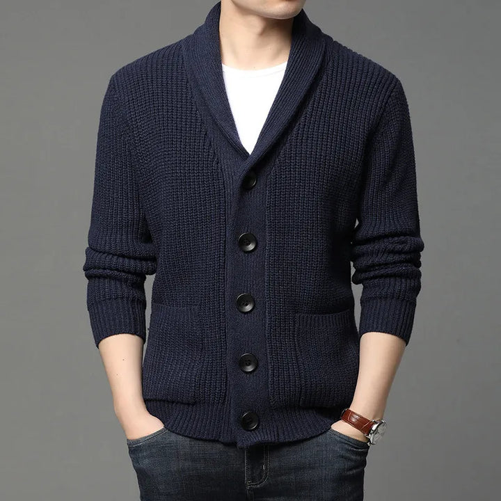 Fashionable men's ribbed knit cardigan featuring a distinctive shawl collar, suitable for layering and casual style.