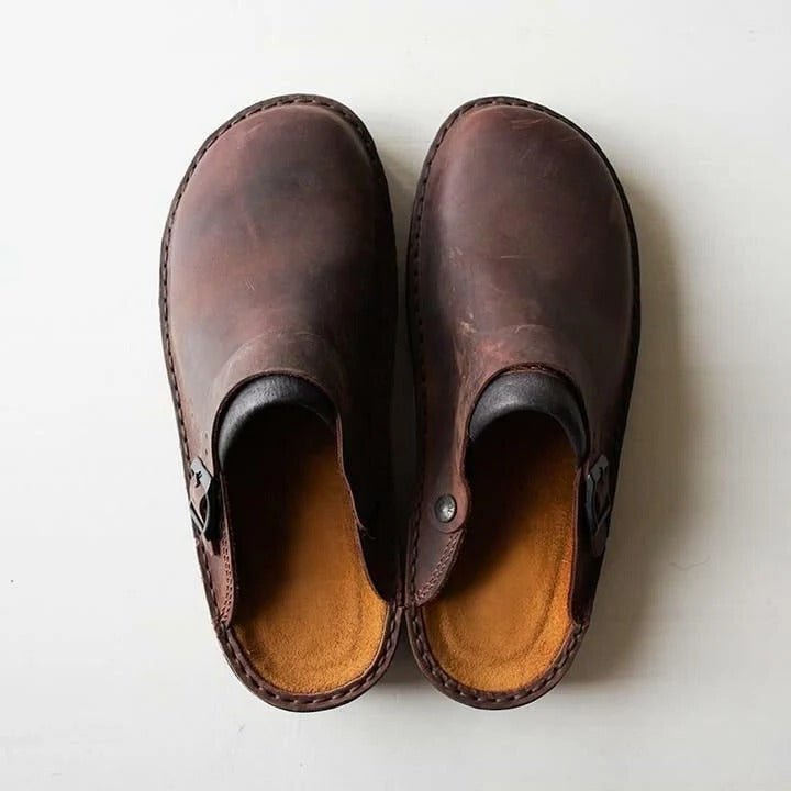 Men's stylish slip-on mules with heel strap for ultimate comfort. Versatile indoor/outdoor footwear.
