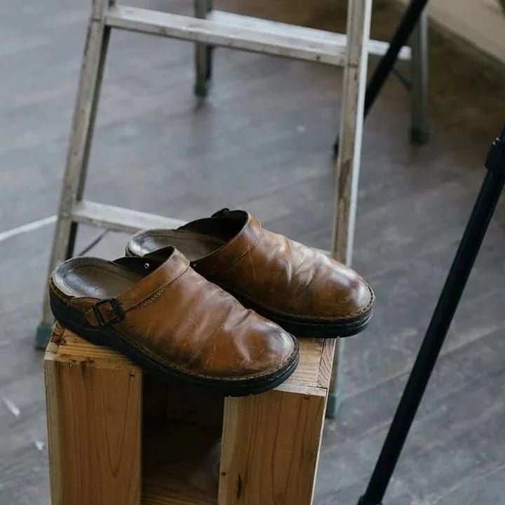 Modern men's slip-on mules, comfortable and stylish. Features a practical heel strap for secure all-day wear.