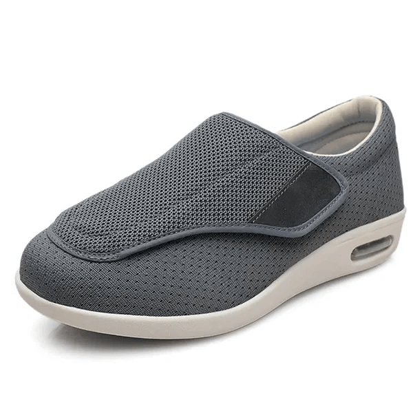 Man wearing SWELLCOMFORT men's wide fit diabetic shoes, memory foam for comfortable daily walking.