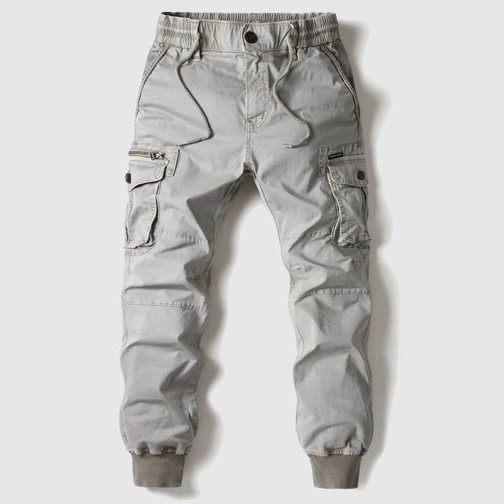 Durable men's tactical utility pants with multiple pockets, ideal for outdoor adventures, activewear & daily comfort.