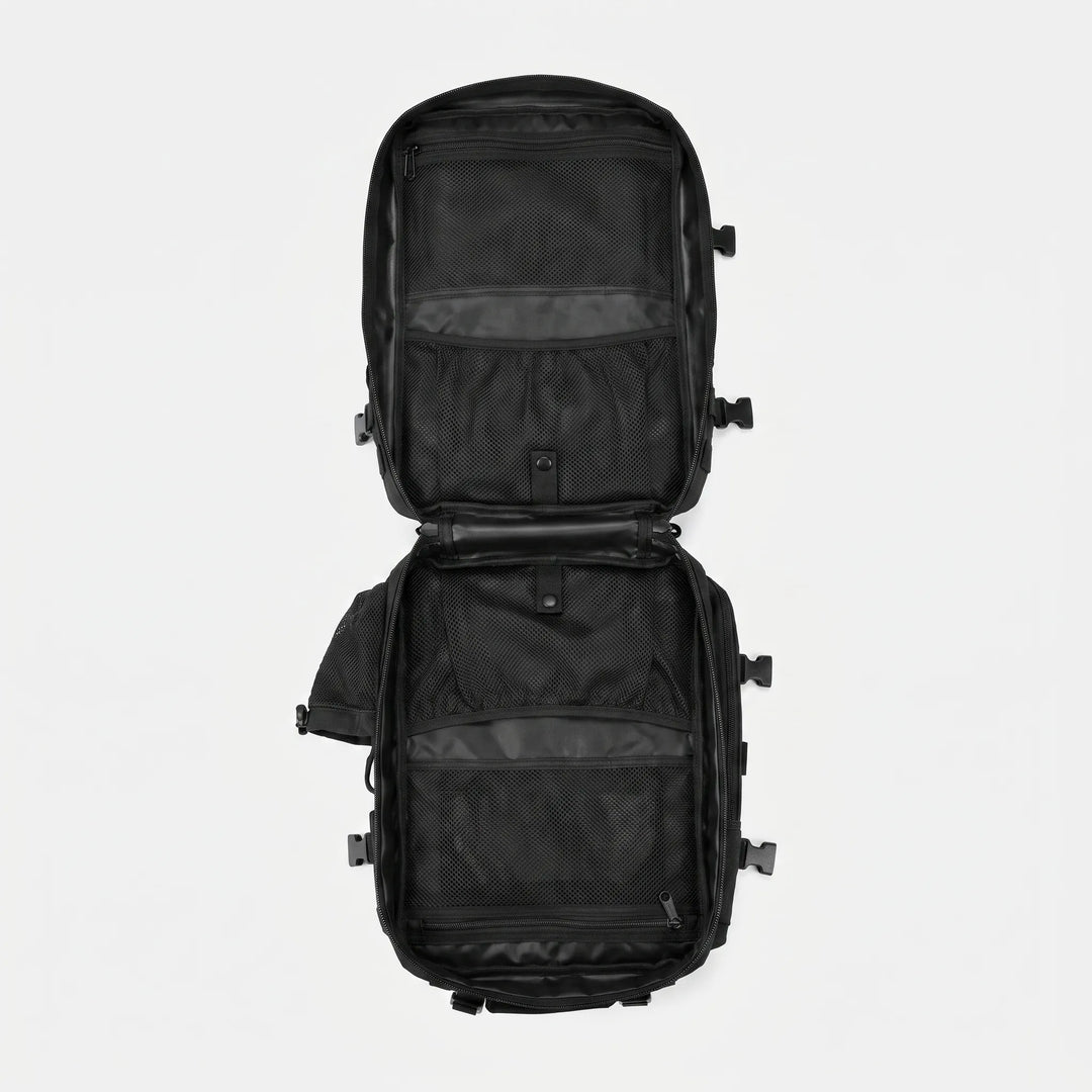 Front utility pocket on a durable tactical backpack, perfect for quick-access camping gear & small items.