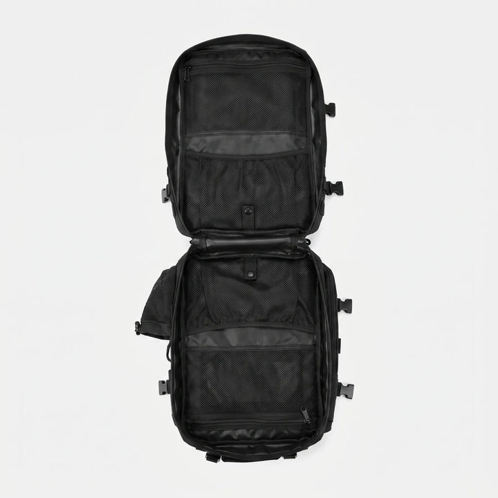 Front utility pocket on a durable tactical backpack, perfect for quick-access camping gear & small items.