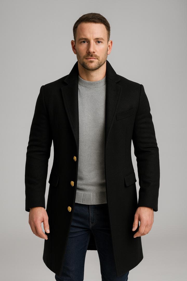 Men's tailored black long trench coat with elegant gold buttons, perfect for formal and smart casual winter wear.