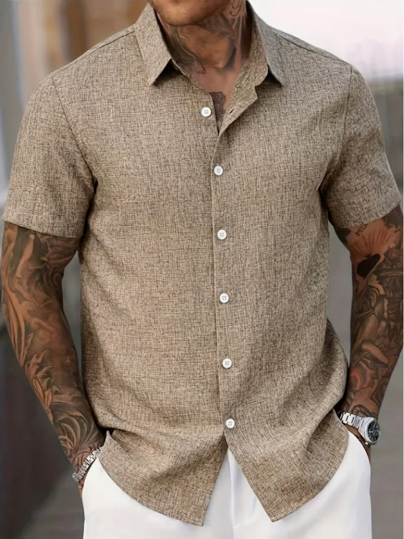 Classic men's textured polo shirt featuring a point collar, short sleeves, and comfortable regular fit for men.