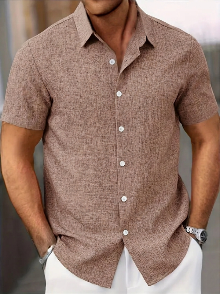 Comfortable men's textured polo shirt with a regular fit and button-down design. A key piece for summer casual wear.