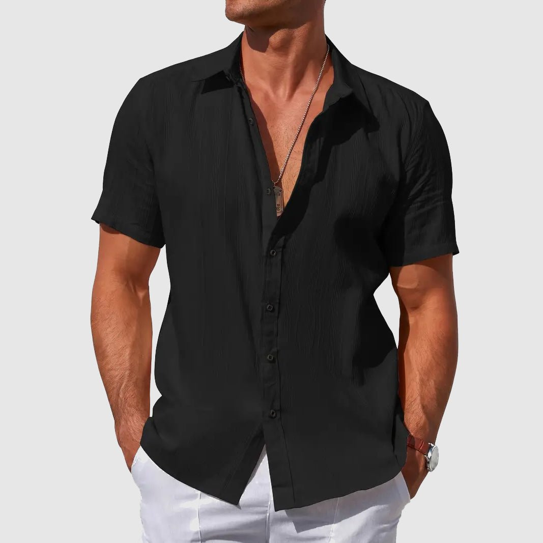 Men's casual short sleeve top with textured fabric. Button front, regular fit, lightweight for warm weather summer comfort.