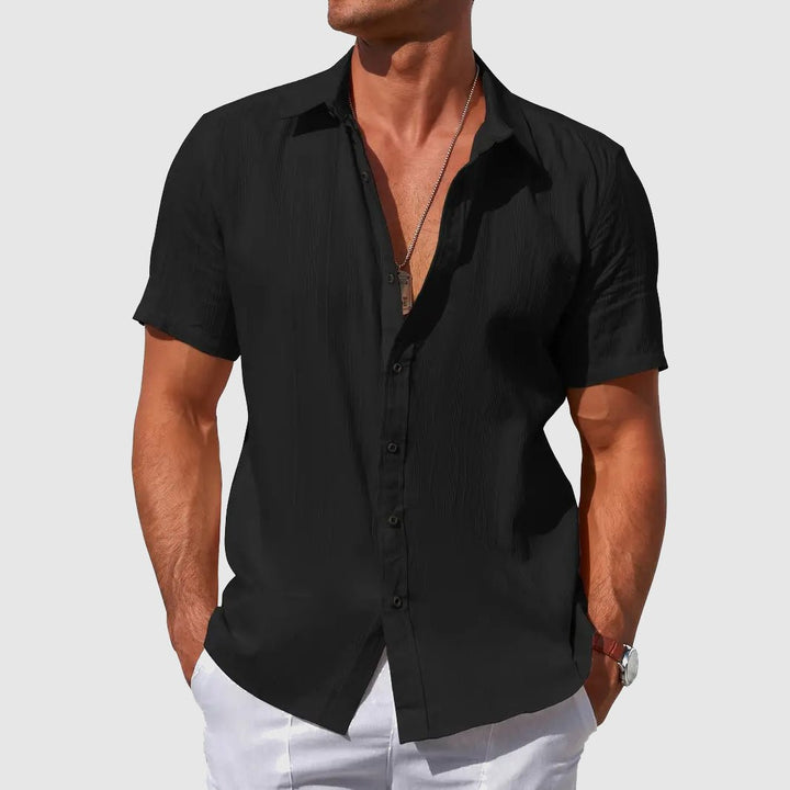 Men's casual short sleeve top with textured fabric. Button front, regular fit, lightweight for warm weather summer comfort.
