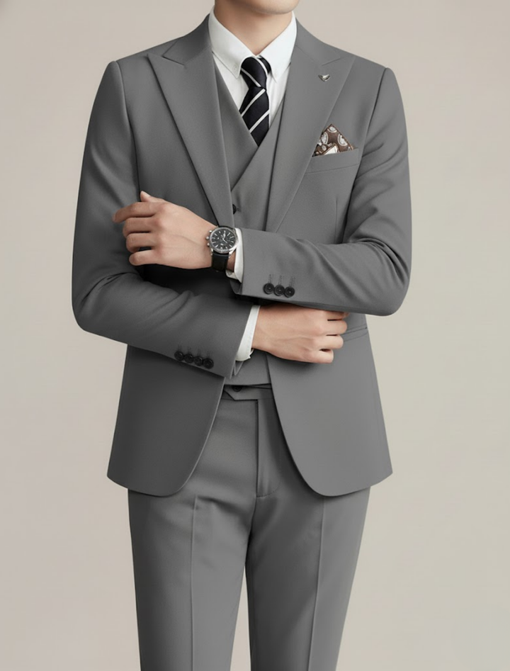 High-quality men's tailored three-piece suit, featuring luxurious fabric for supreme formal event comfort.