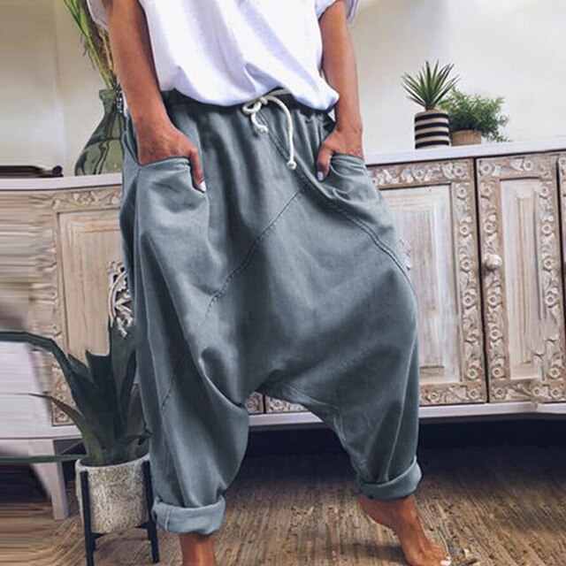 Stylish men's boho harem pants, versatile for casual wear. Comfortable loose-fit trousers for all-day comfort.