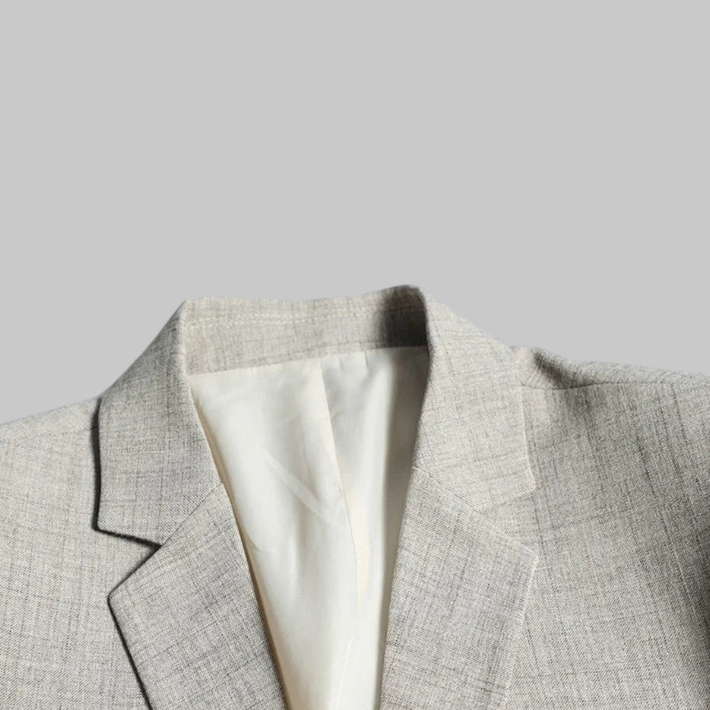Fashionable men's two-button single-breasted blazer, a versatile piece for business casual and formal attire.