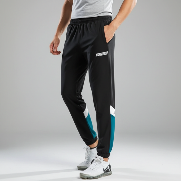 Stylish men's color block track pants for activewear. Two-tone design, perfect for gym workouts, jogging & casual comfort.