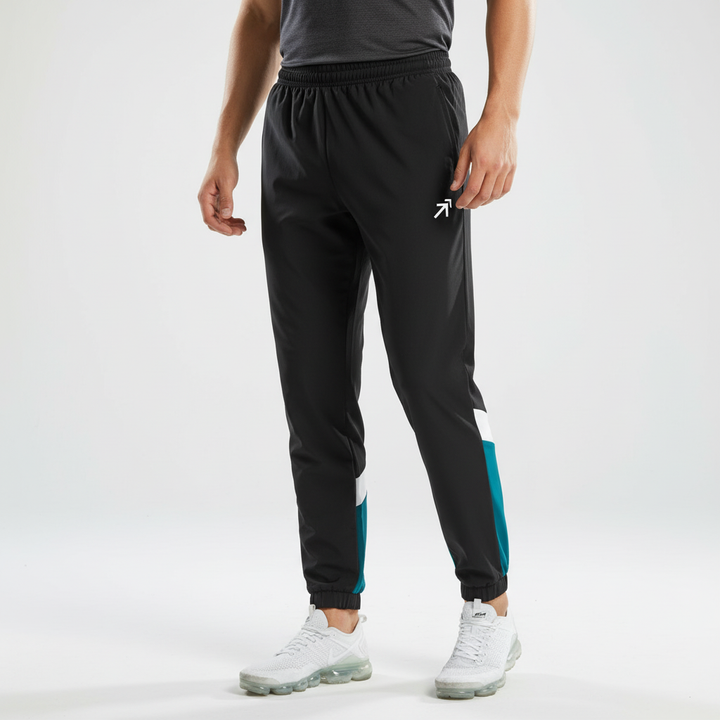 Modern men's two-tone color block track pants. Athletic joggers designed for comfort during workouts, sports, & casual outings.