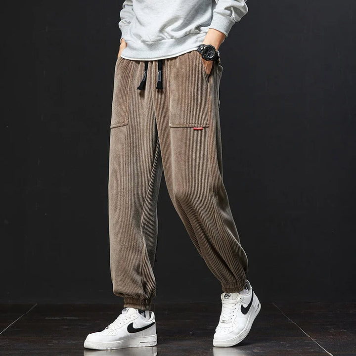 Fashionable men's relaxed fit joggers, versatile casual pants with drawstring for ultimate comfort.