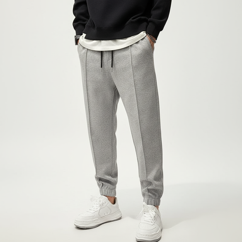 Flexible men's training pants, Tanner, featuring an elastic waist & tapered fit for optimal athletic performance.