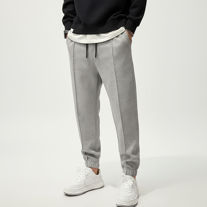 Flexible men's training pants, Tanner, featuring an elastic waist & tapered fit for optimal athletic performance.