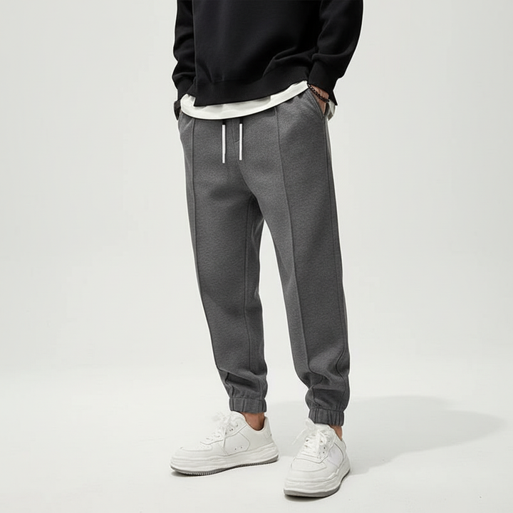 Men's versatile active pants, elastic waist, suitable for gym, running, or relaxed casual styling.