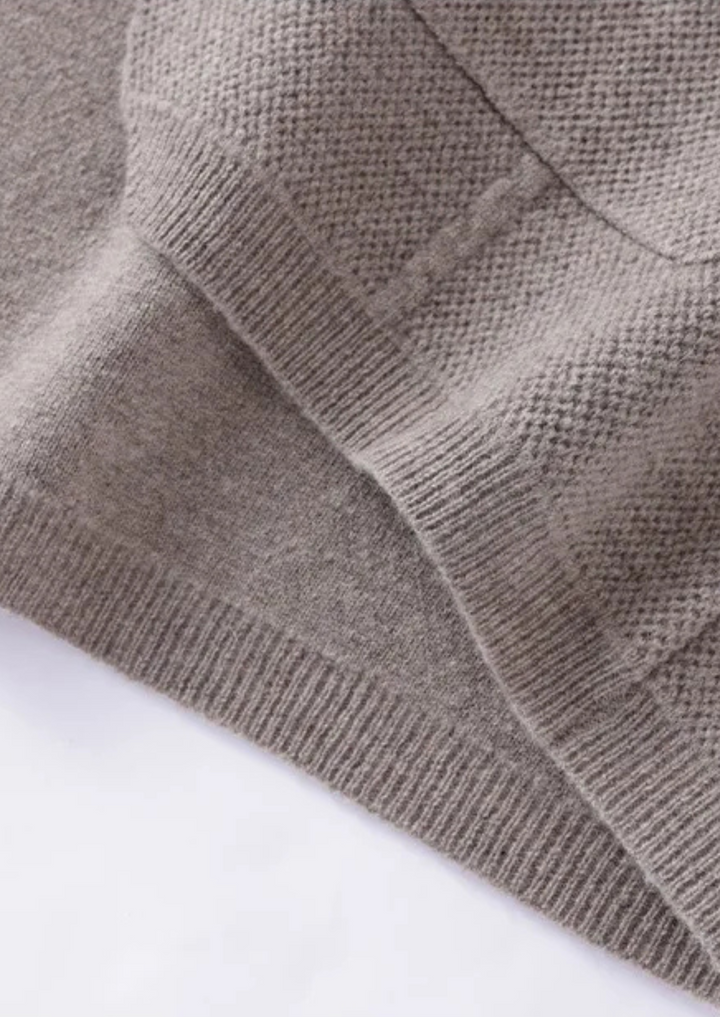 Classic men's button-up cardigan sweater, an all-season layering piece. Ideal for versatile casual & business casual style.