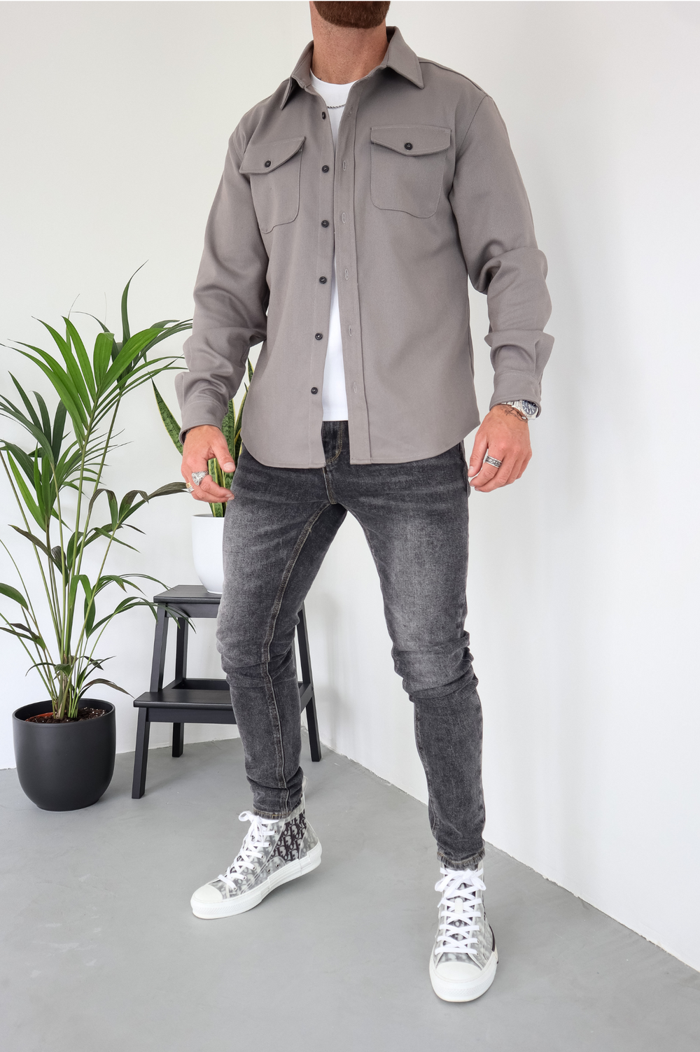 Transitional men's long sleeve overshirt jacket; comfortable button-up shacket with chest pockets.