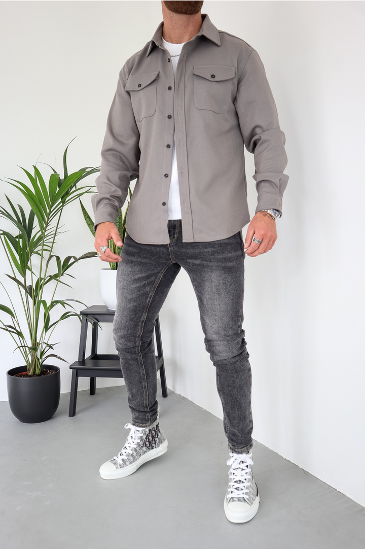 Transitional men's long sleeve overshirt jacket; comfortable button-up shacket with chest pockets.