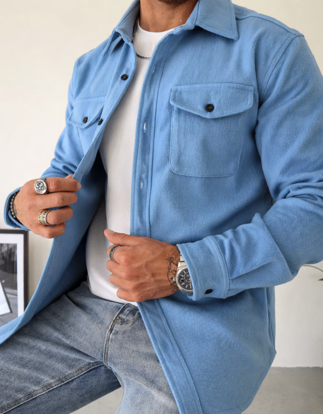 Modern men's button-up overshirt jacket, a stylish shacket with pockets for a smart casual look.