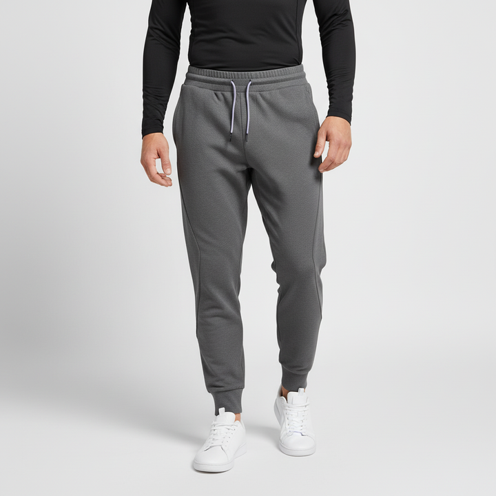 Men's versatile elastic-waist joggers for activewear, lounging, or casual style. Comfortable fit.