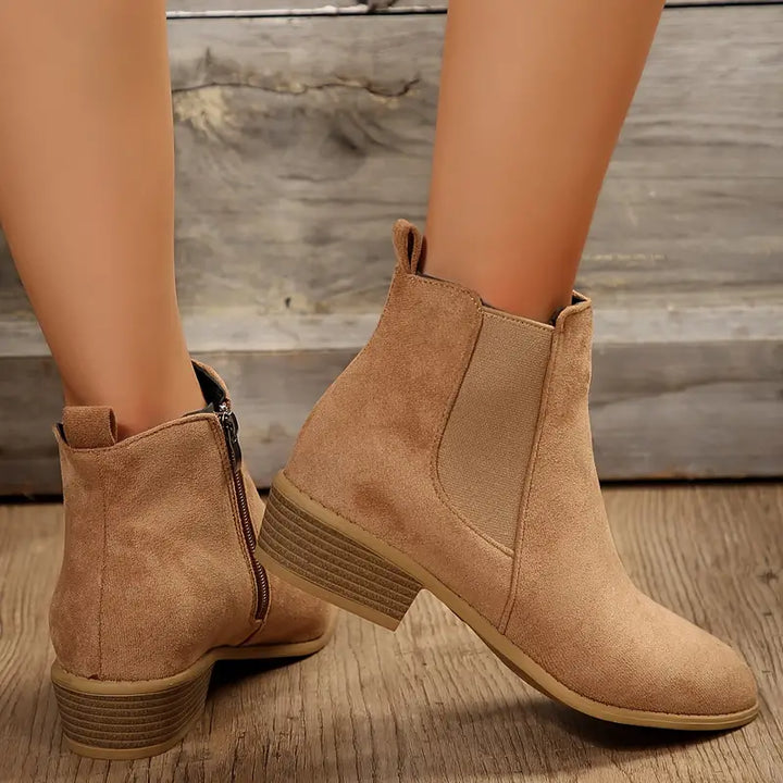 Durable men's brown leather Chelsea boots, featuring a convenient pull-on tab and sturdy sole for versatile wear.