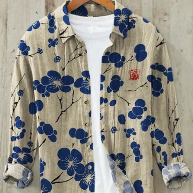 Stylish men's button-up top featuring a unique Japanese Great Wave art print. Ideal for cultural fashion.