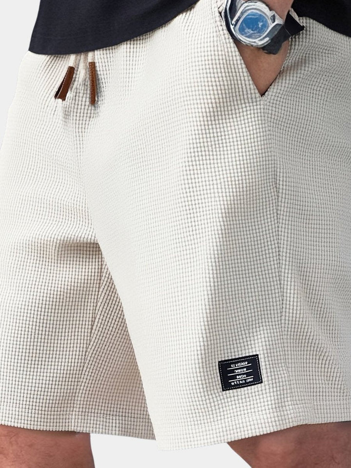 Men's waffle knit shorts, relaxed fit for ultimate comfort. Perfect casual loungewear.