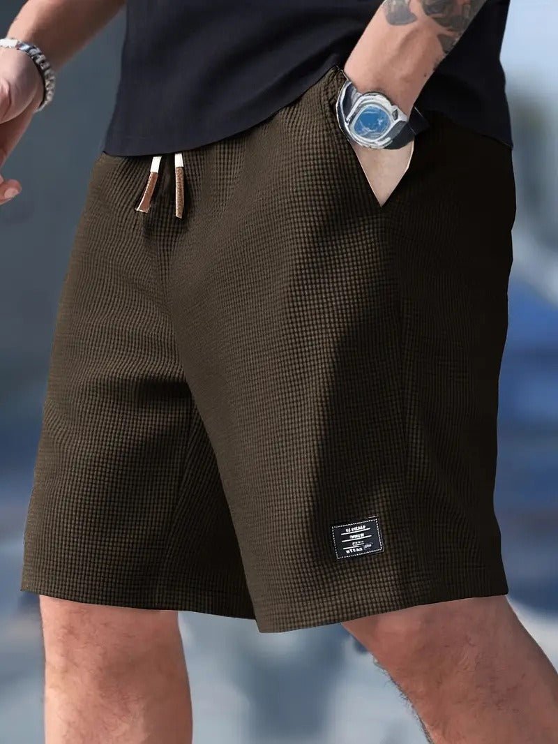 Detailed view of men's waffle knit relaxed fit shorts, highlighting the textured fabric & comfortable design.