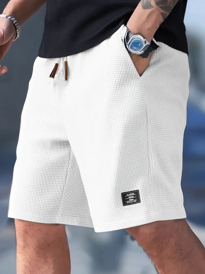 Versatile men's relaxed fit shorts. Waffle knit design ensures comfort for casual outings & loungewear.