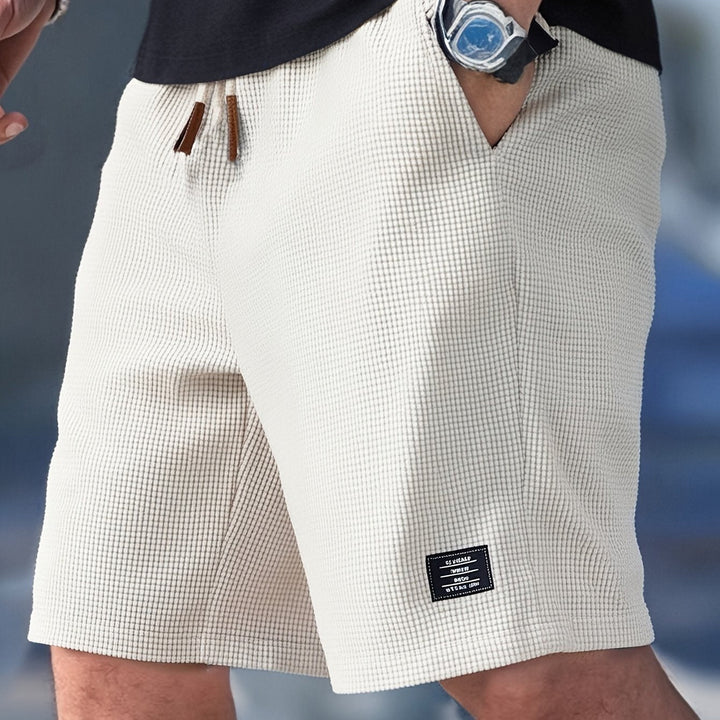 Textured men's waffle knit shorts, relaxed fit for breathable summer comfort & everyday wear.