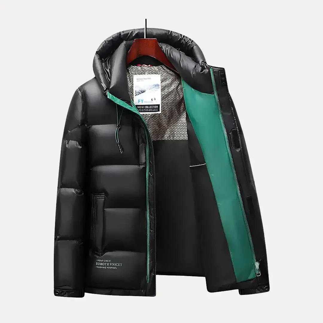 Durable men's hooded puffer jacket, quilted for superior warmth. Essential winter outerwear for cold weather protection.