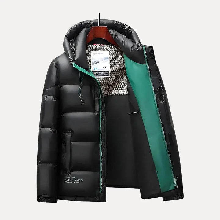 Durable men's hooded puffer jacket, quilted for superior warmth. Essential winter outerwear for cold weather protection.