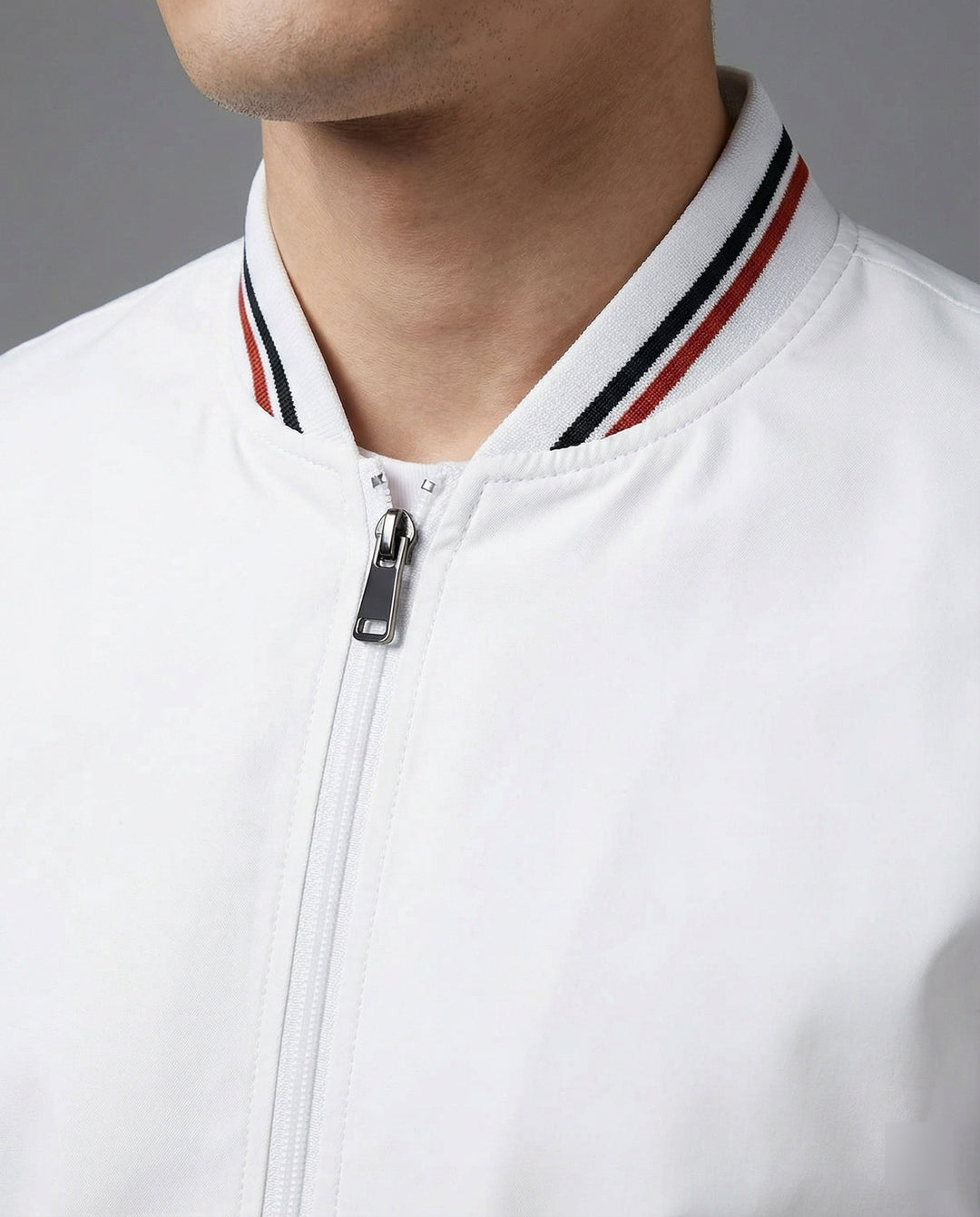 Man wearing a sleek water-repellent casual jacket with stand-up collar, ideal for urban outdoor activities and everyday fashion.