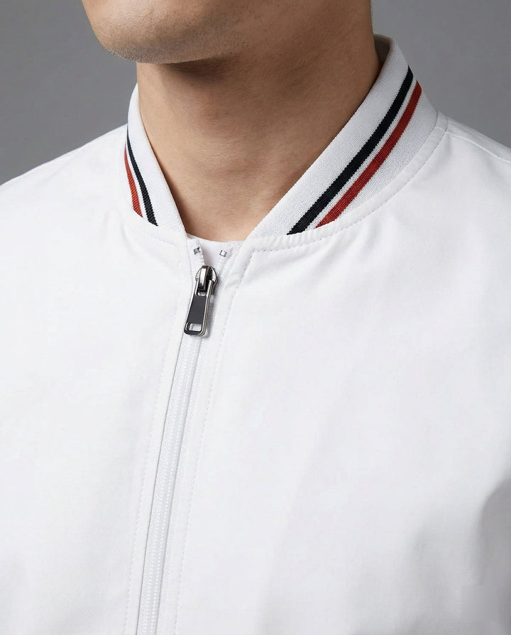 Man wearing a sleek water-repellent casual jacket with stand-up collar, ideal for urban outdoor activities and everyday fashion.