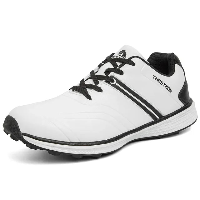Close-up of waterproof synthetic leather on men's golf shoes, highlighting durable texture & fixed spike sole.