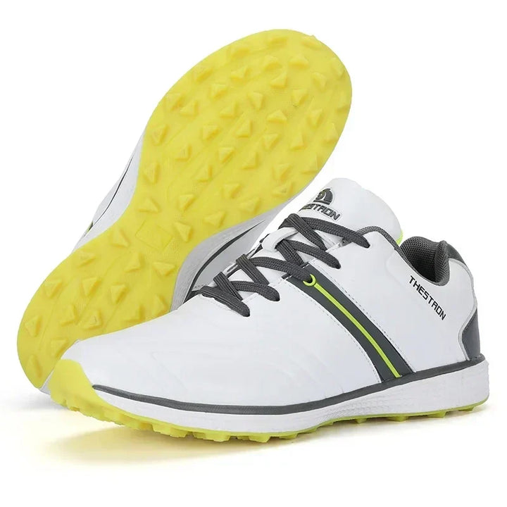 Golfer wearing men's waterproof golf shoes with fixed spikes, ready for a swing, demonstrating course traction.