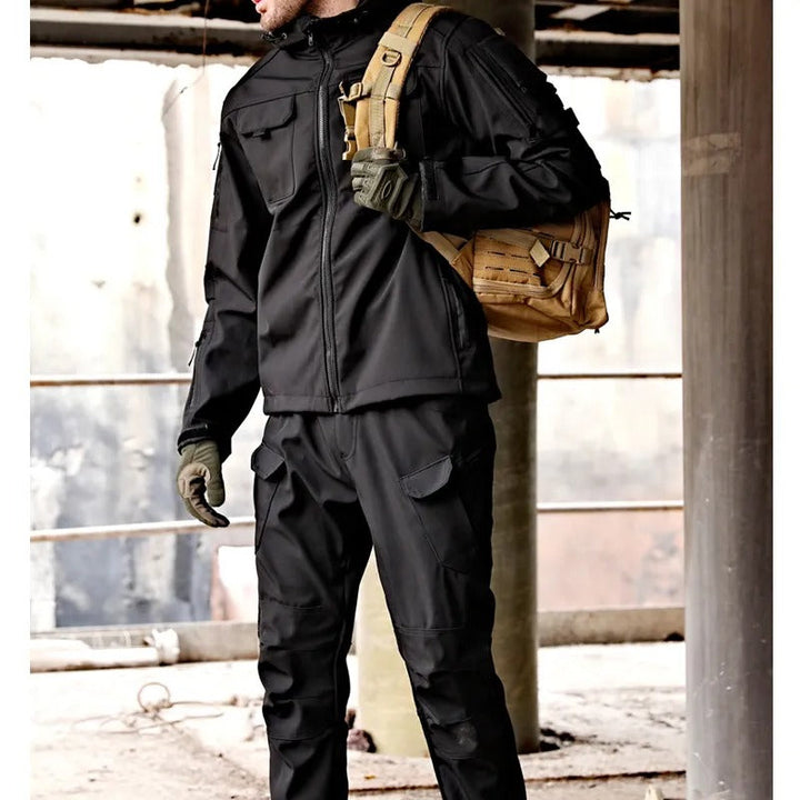 Full men's waterproof outdoor gear set: jacket & pants. Essential expedition wear for extreme cold and rain.