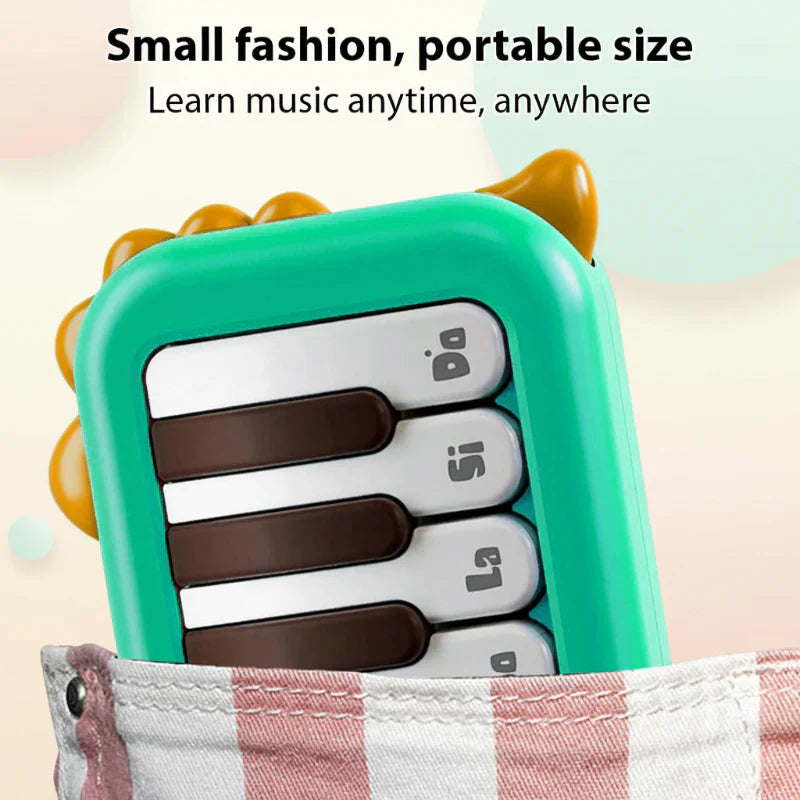 Top view of a compact electronic piano for kids, featuring lighted keys and portable design